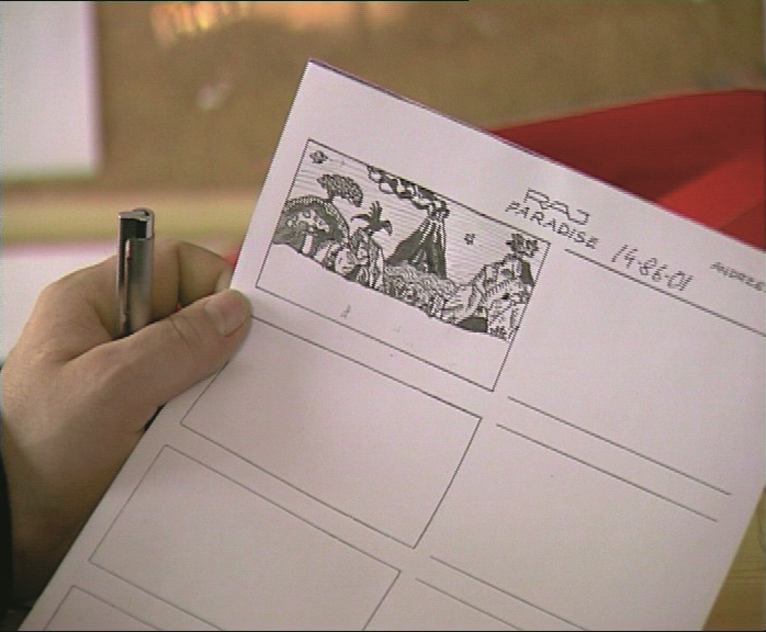 Animator drawing at illuminated desk for EDEN